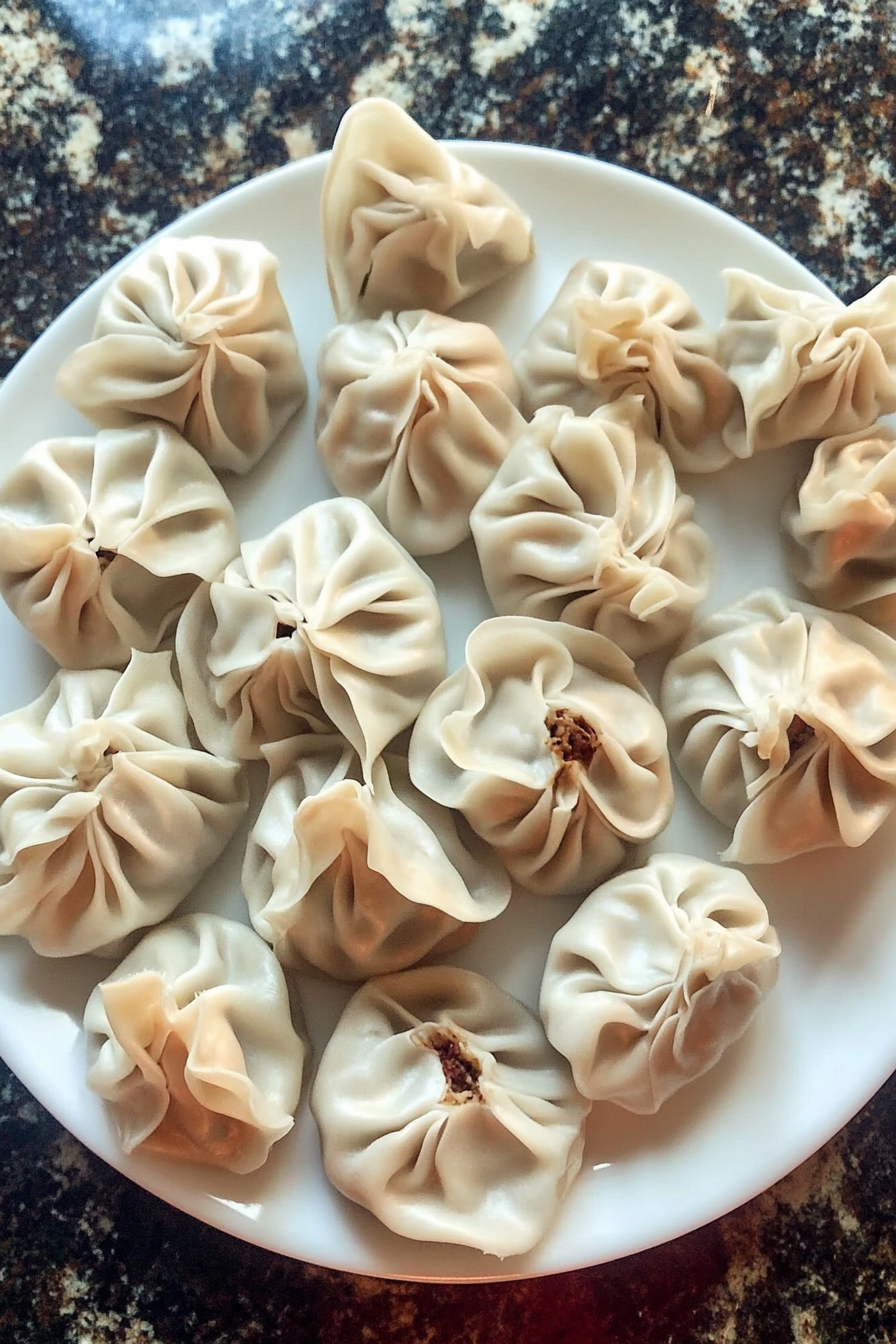 Close-up of hands kneading dough for vegan soup dumplings, perfect for homemade recipes.