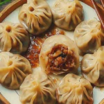 Close-up of steaming vegan soup dumplings with delicate folds, showcasing their gourmet plant-based appeal.